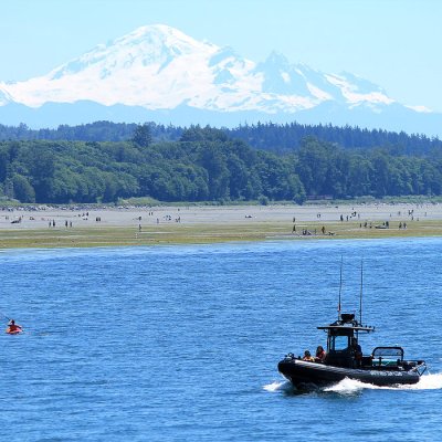 Boat on water with mount baker in the background