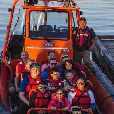 a group of people on a boat in the water