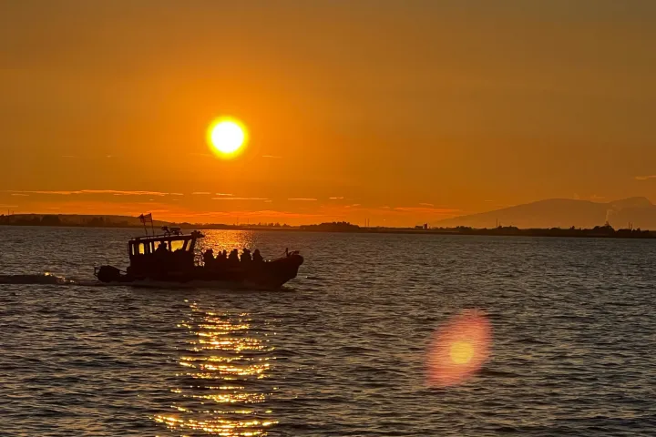 a sunset over a body of water
