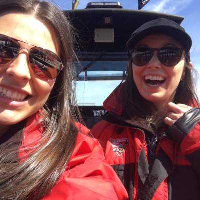 a woman wearing sunglasses posing for the camera