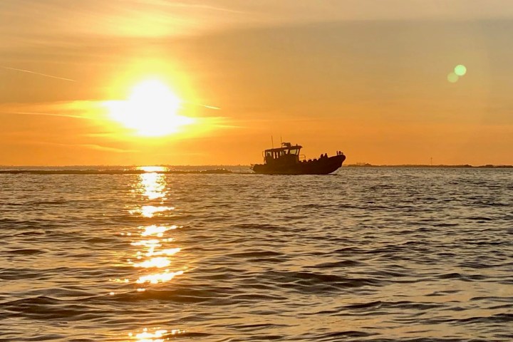 a sunset over a body of water