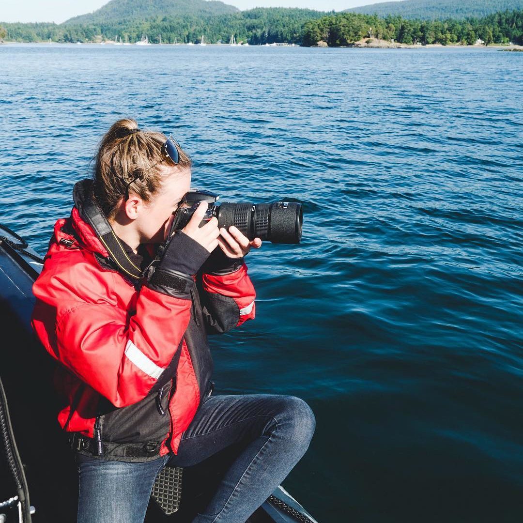 Photographer taking pictures of Killer Whales