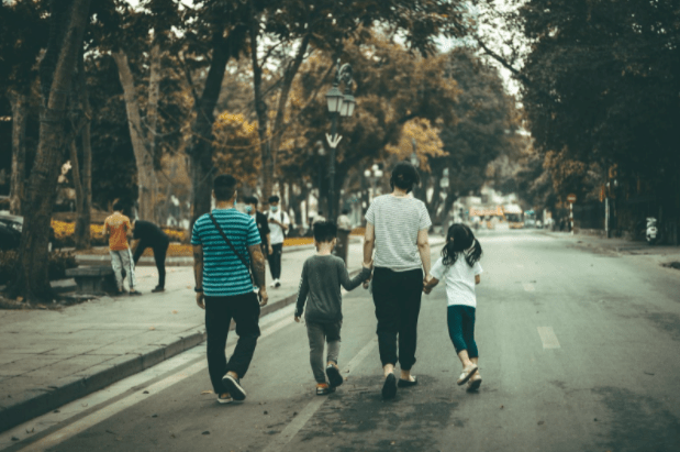 a group of people walking down the street