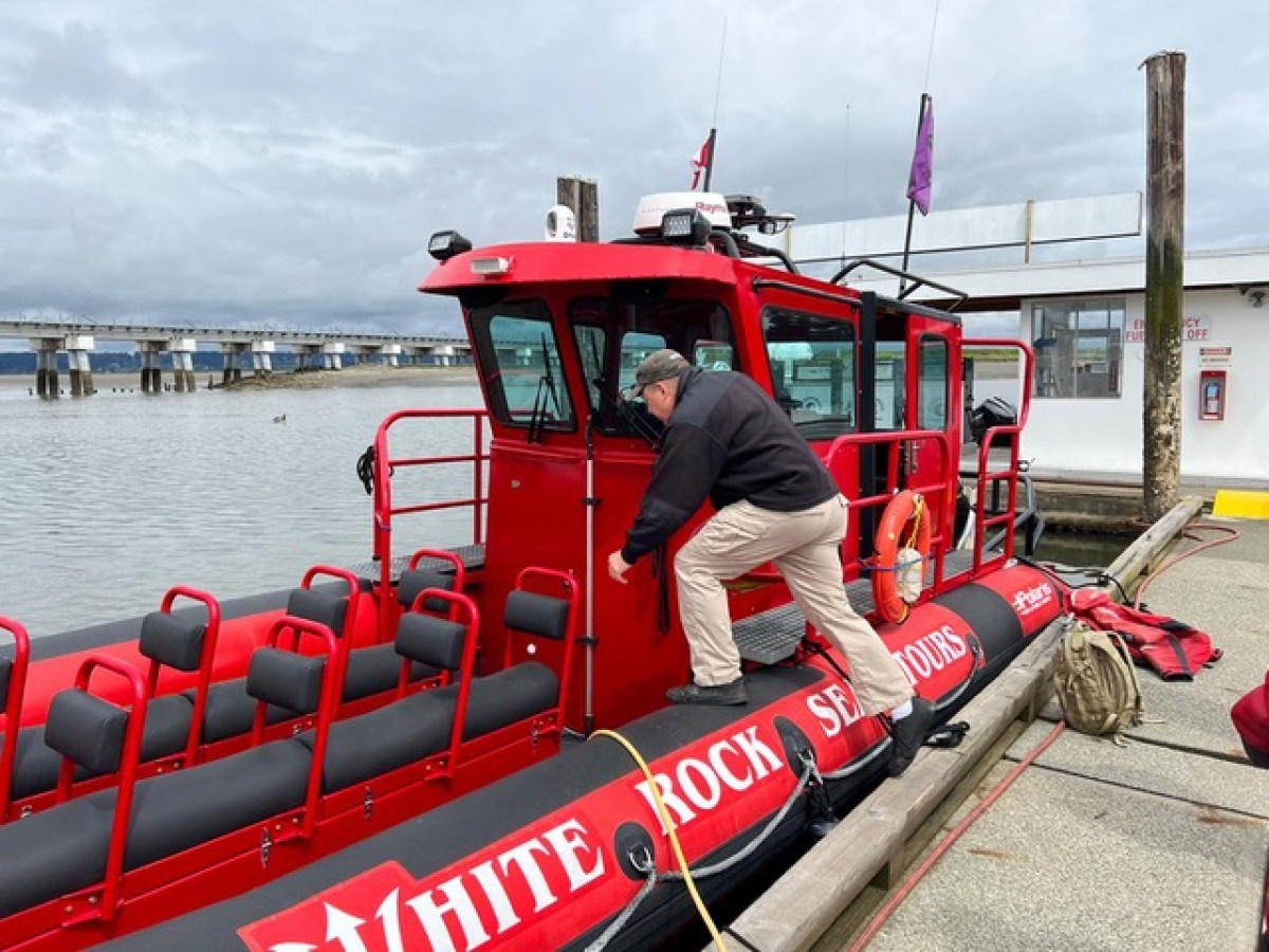 a man sitting on a boat