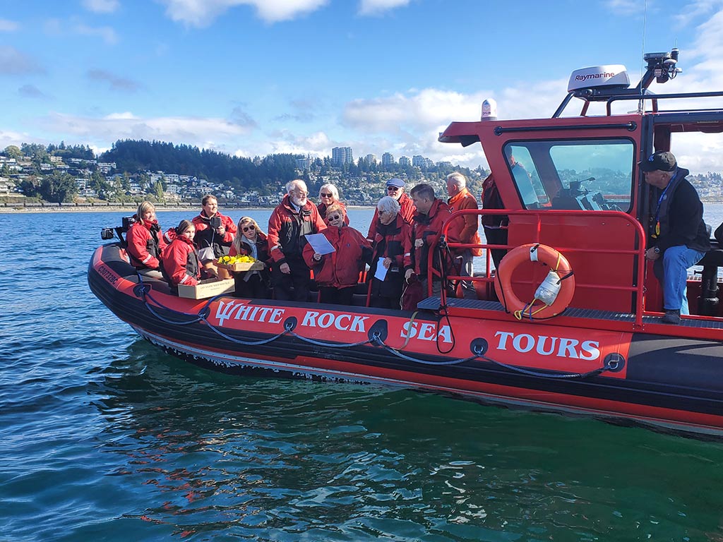 People on boat Scattering Ashes for loves one.